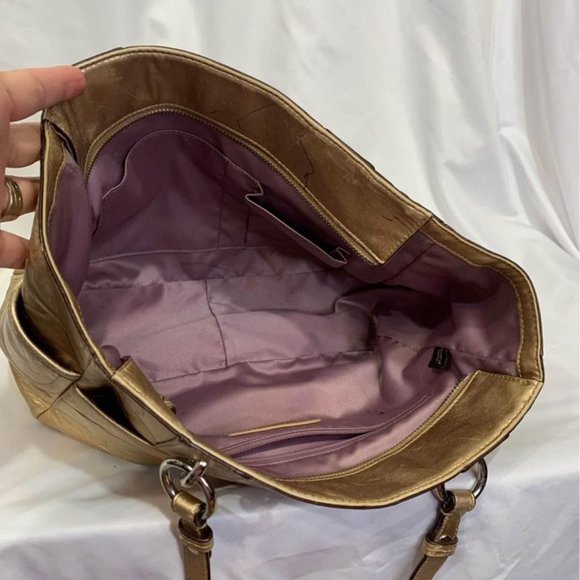 COACH gold handbag. Purple lining. Embedded coach logo. Big outside pock… - Picture 8 of 10